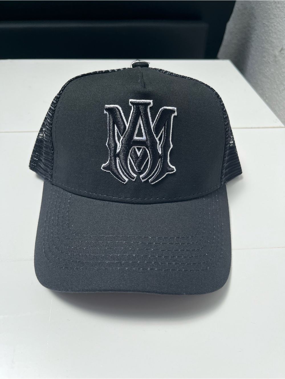 Amiri Black Trucker Hat with White Embroidered Monogram